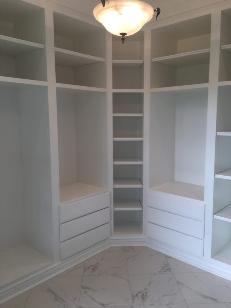 Custom Built-In Cabinetry and Wainscoted Storage Surround