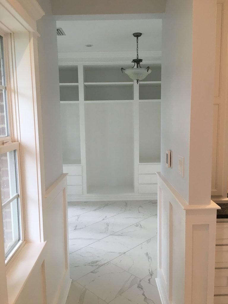 Integrated Storage Cabinets with Clean, White Panel Detailing