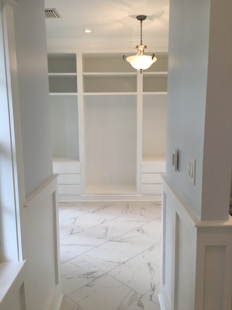 Integrated Storage Cabinets with Clean, White Panel Detailing