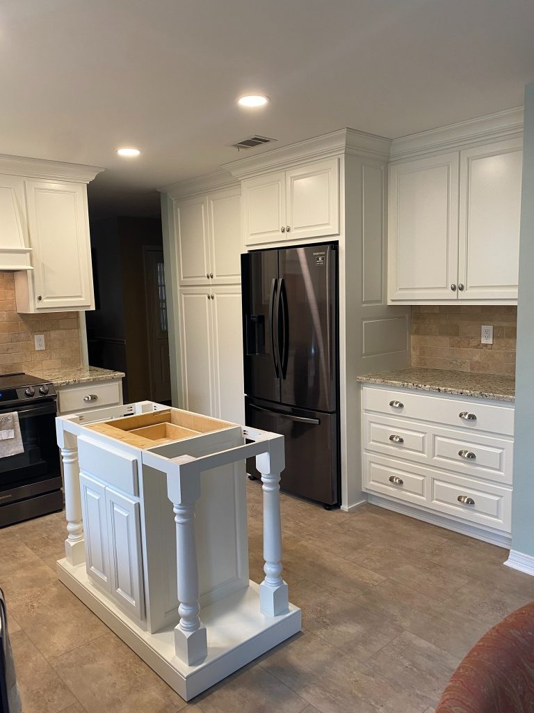 Custom Cabinetry and Built-In Appliance Wall with Decorative Island Base