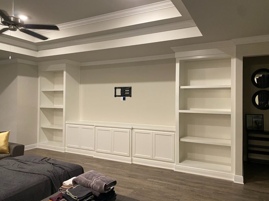 Custom Built-In Entertainment Wall with Flanking Bookcases and Lower Cabinet Storage