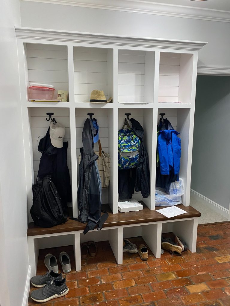 Custom Mudroom Locker System with Open Cubbies and Built-In Bench Seating