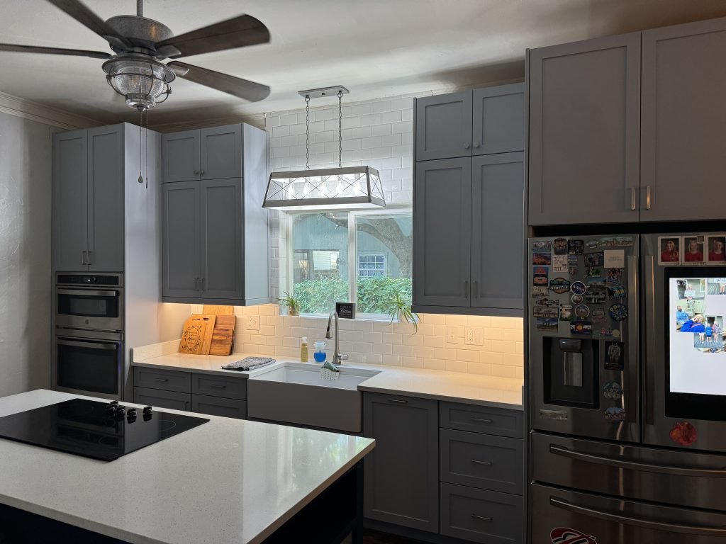 Contemporary Kitchen with Navy Island & Quartz Countertops