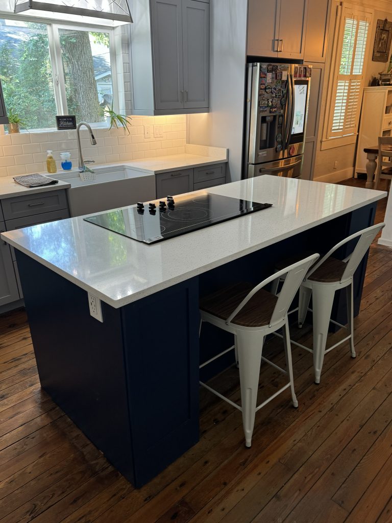 Bright Contemporary Kitchen Featuring a Large Quartz Island