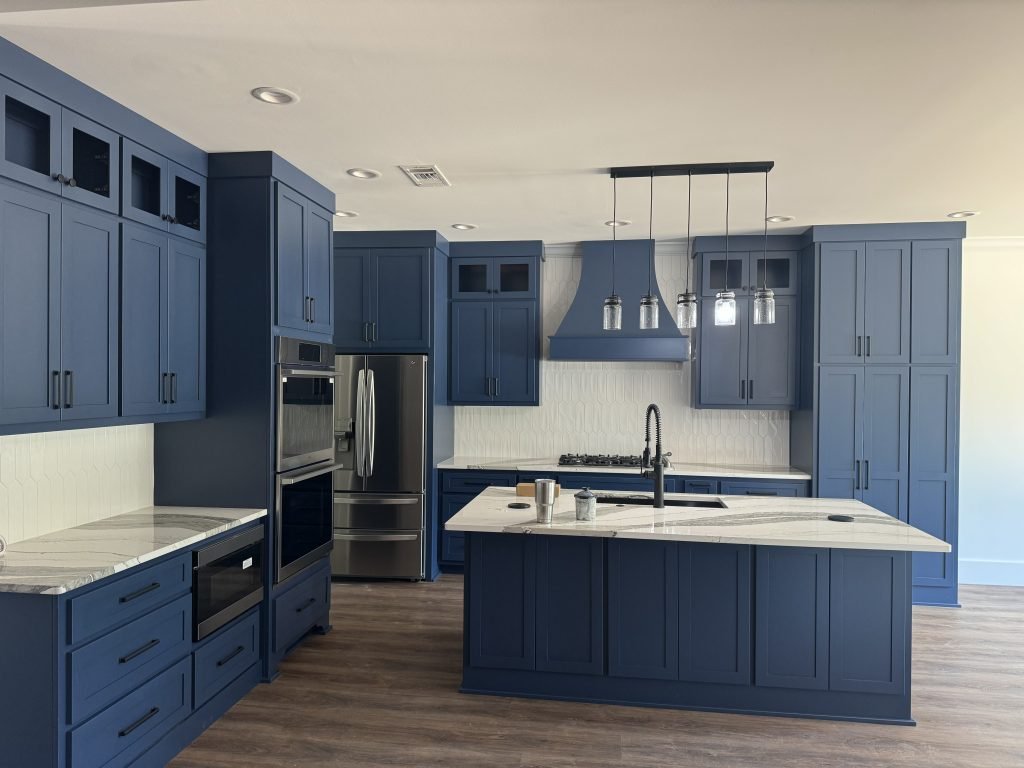 Corner Kitchen Cabinets in Navy Blue with Built-in Double Oven and Microwave Blue Kitchen Cabinets